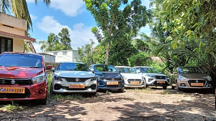 Our cars parked in our ground, Arrow cabs Trivandrum